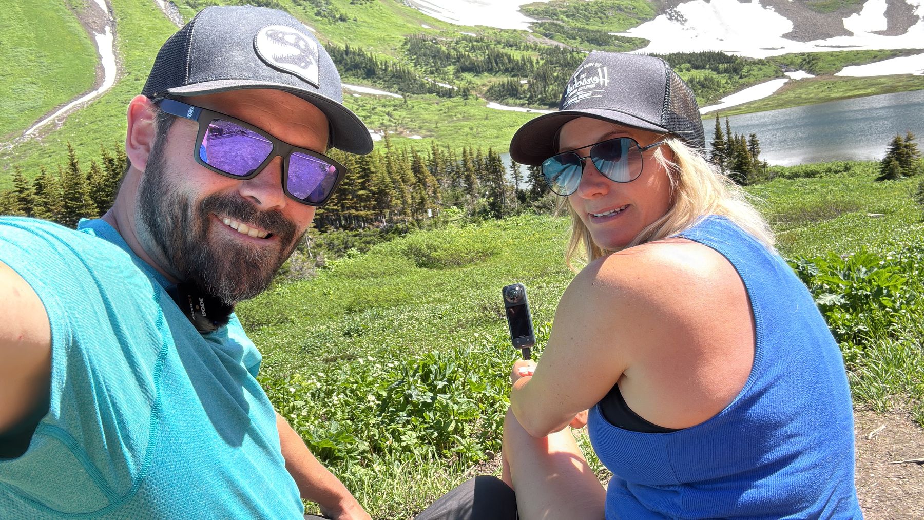 Ryan and Stacie taking a selfie on arrival at Windfall Lake with the meadow and snowfields behind