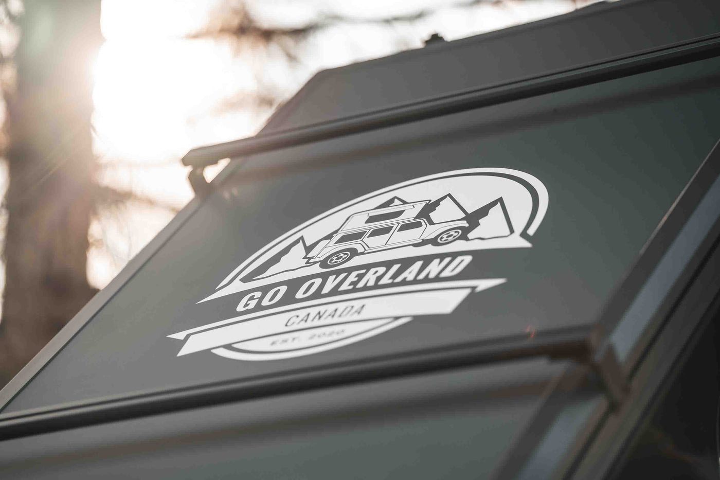The Go Overland badge on a Summit Lite shell