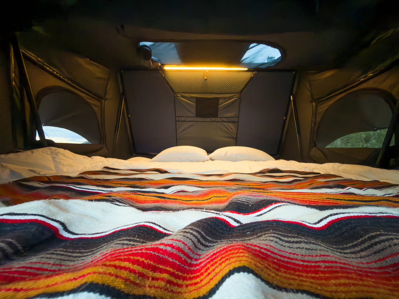 The made bed inside an Expedition Max