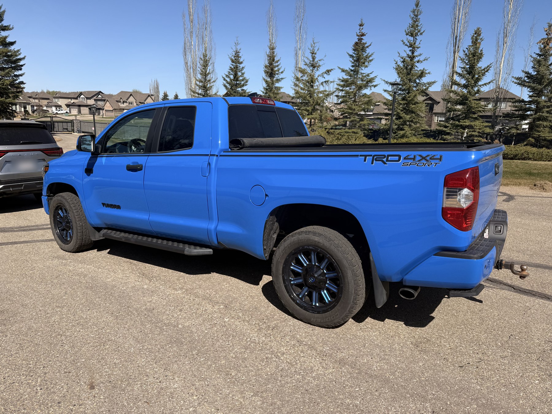 The Tundra from three-quarter rear, showing the TRD 4x4 Sport badging